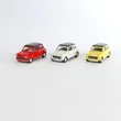 Austin Mini Cooper 1300 - modellautó 1:60 - csak sárga színben Austin Mini Cooper 1300 - modellautó 1:60 - csak sárga színben