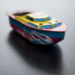 Yacht steempressed  tin toy with candle
