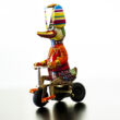 Duck on tricycle tin toy