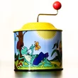 Baby hand-organ tin toy with Maya Bee grafic