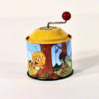 Baby hand-organ tin toy with Maya Bee grafic