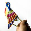 Whisting bird tin toy