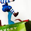 Blue Rugby player tin toy