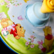 Humming top with Winnie the Pooh grafic 13cm