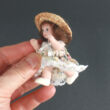 Porcelain doll with straw 7,5 CM