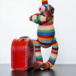 Rainbow Rabbit in red suitcase