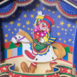 Musical money bank with riding clown