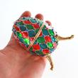 Vörös-zöld- kék színű, káró mintás zenélő Faberge tojás Vörös-zöld- kék színű, káró mintás zenélő Faberge tojás