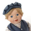 Zenélő, táncoló porcelán fiúbaba 42cm- kék ruhában Zenélő, táncoló porcelán fiúbaba 42cm- kék ruhában