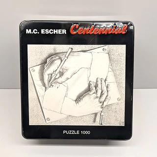 M.C. ESCHER - Egymást rajzoló kezek 1000 db-os puzzle fém dobozban M.C. ESCHER - Egymást rajzoló kezek 1000 db-os puzzle fém dobozban