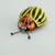 Colorado beetle tin toy